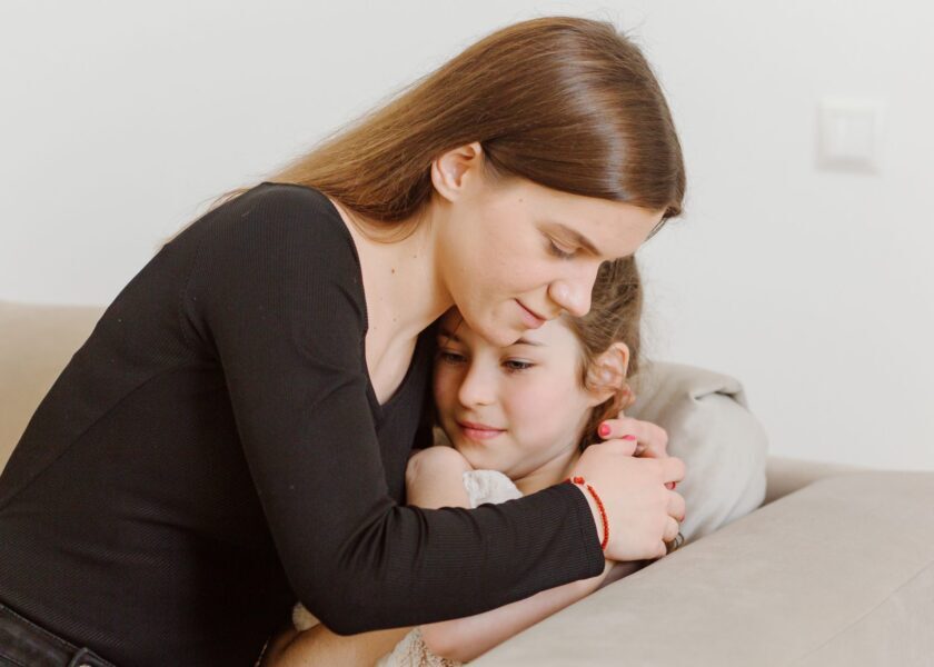 mother-hugging-scared-daughter-2048×1365